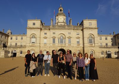 International delegates pose for a group photo on Horse Guards Parade in evening sunshine